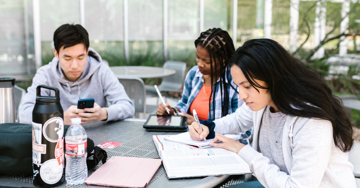 Diverse group of people studying together at a table
